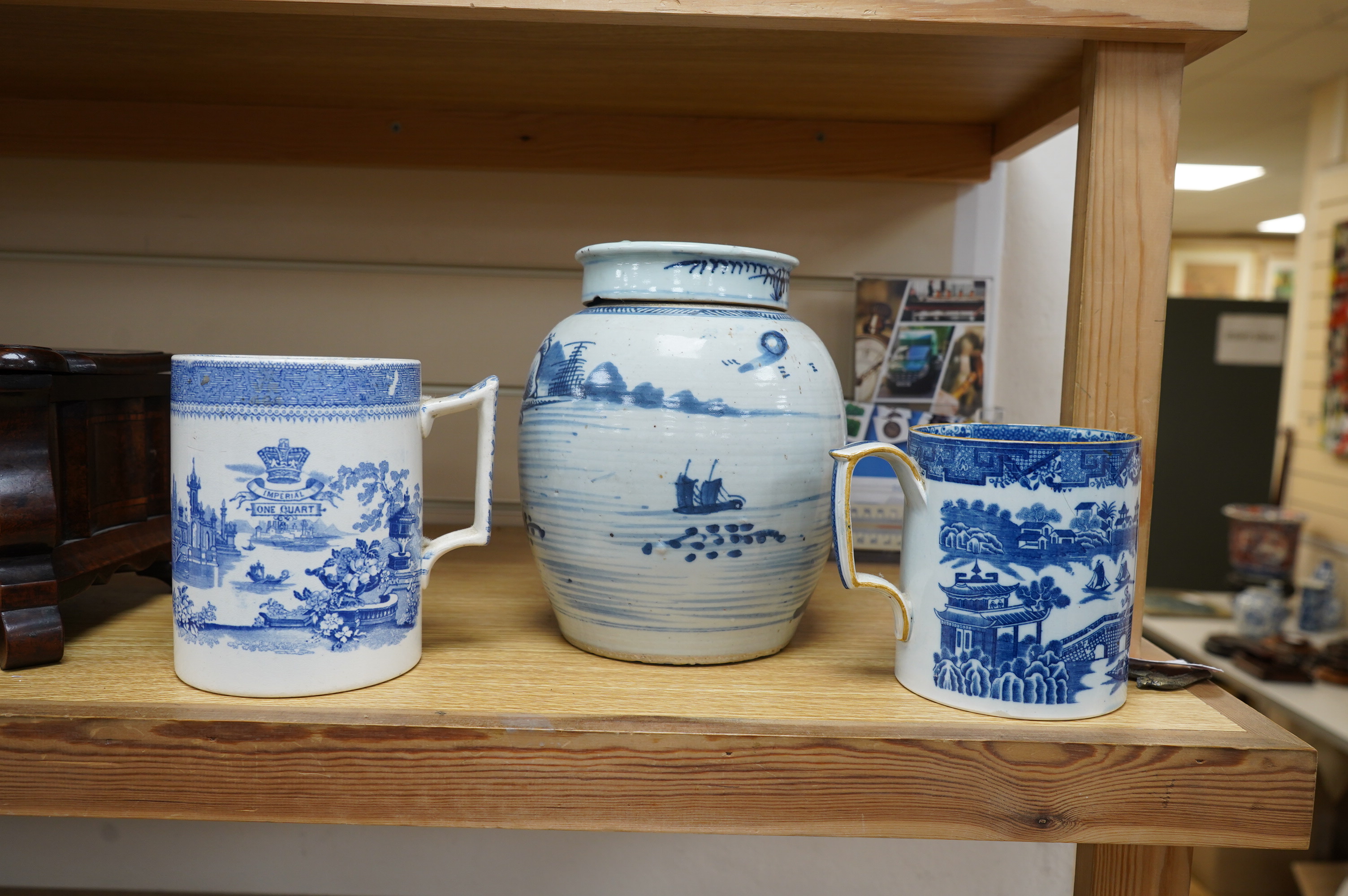 A 19th century Chinese blue and white ginger jar and cover and two pieces of Staffordshire blue-printed pottery, tallest 21cm. Condition - fair